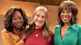 Oprah Winfrey models orange pantsuit with Gayle King and Melinda Gates