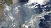 Satellites capture smoke pouring from hundreds of wildfires across North America (photos)