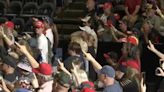 Is Trump fans’ ‘weird’ one-finger salute at rally a QAnon tribute?