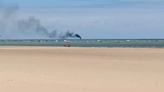 Rescate en Chipiona tras salir una embarcación ardiendo frente a la playa Cruz del Mar