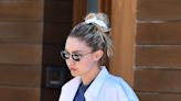 Gigi Hadid Is Sporty-Cool in Cowboys Top, Cutout Jeans & Platform Sneakers