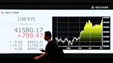 Asia shares dip; New Zealand dollar firms ahead of RBNZ