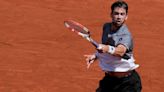 Cameron Norrie comes through five-set battle with home favourite Benoit Paire