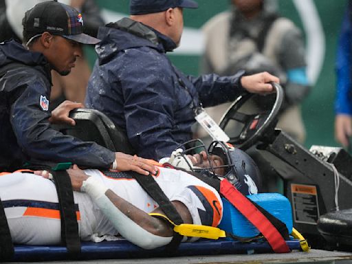 Broncos RB Tyler Badie stabilized on stretcher after collapsing on sideline with back injury