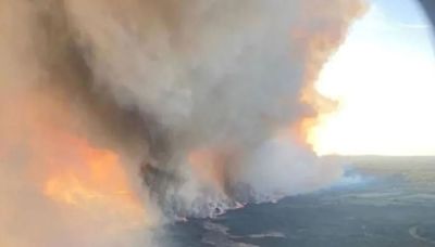 Dozens of blazes burning in Canada are sending smoke to the US. Two major fires have forced hundreds of evacuations