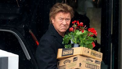 Richard Wilkins and girlfriend Mia Hawkswell spotted carrying flowers