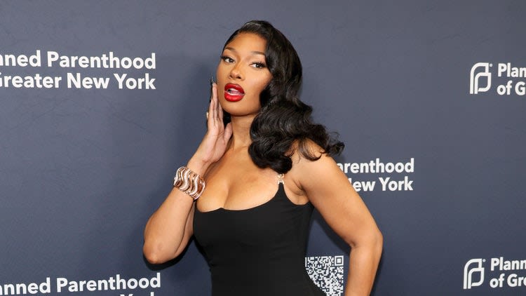 Megan Thee Stallion keeps the snake theme going by shedding her skin in lusty photos