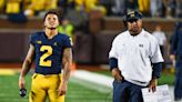 Michigan assistant Mike Hart carted off field after reported seizure