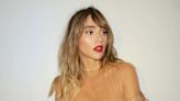 Suki Waterhouse's thigh high lace stockings and sheer blouse are a sultry victorian housewife cosplay