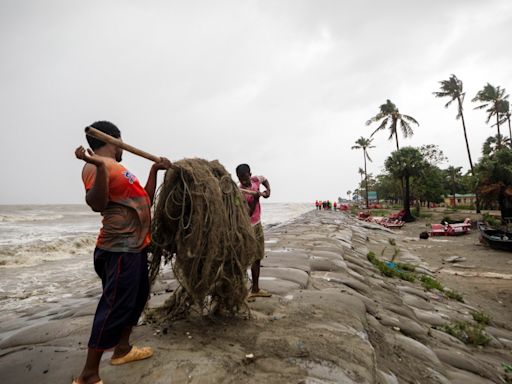 Cyclone floods coastal villages, blows away thatched roofs and cuts power in Bangladesh and India