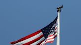 Why American flags being flown at half-staff in Delaware and for how long?