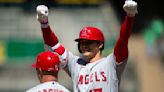 Angels score 11 in 3rd inning, thump Fujinami and A's 13-1