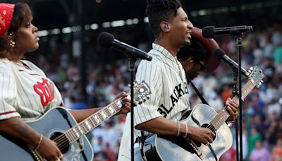 Jon Batiste performs at MLB tribute game