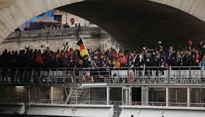 All eyes on France: Rain, security checks fail to dampen cheer at Olympics opener