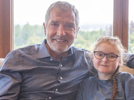 Football legend fights back tears over girl living with rare skin condition | ITV News