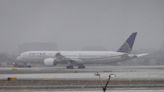 Nearly 1,500 flights canceled as massive winter storm system blankets northern US