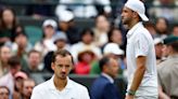 Dimitrov injury sends Medvedev through to Wimbledon quarter-finals