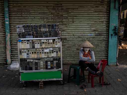 E-waste is overflowing landfills. At one sprawling Vietnam market, workers recycle some of it