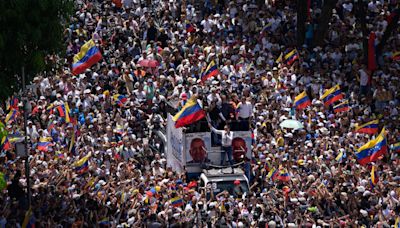 Thousands of Venezuelans march over contested election despite warnings from Maduro