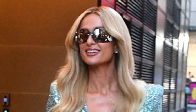 Paris Hilton puts on a glamorous display in blue sequin minidress