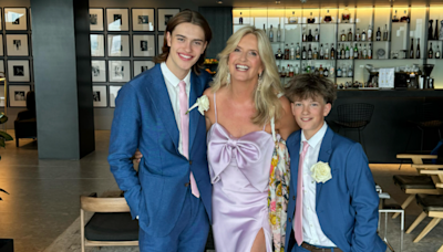 Penny Lancaster beams with pride as she poses with her sons and Rod at Stewart family wedding