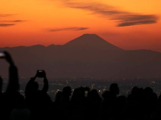 Japan, famously polite, struggles to cope with influx of tourists