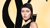 Iris Law serves scuba chic in satin skull cap and backless LBD in Paris