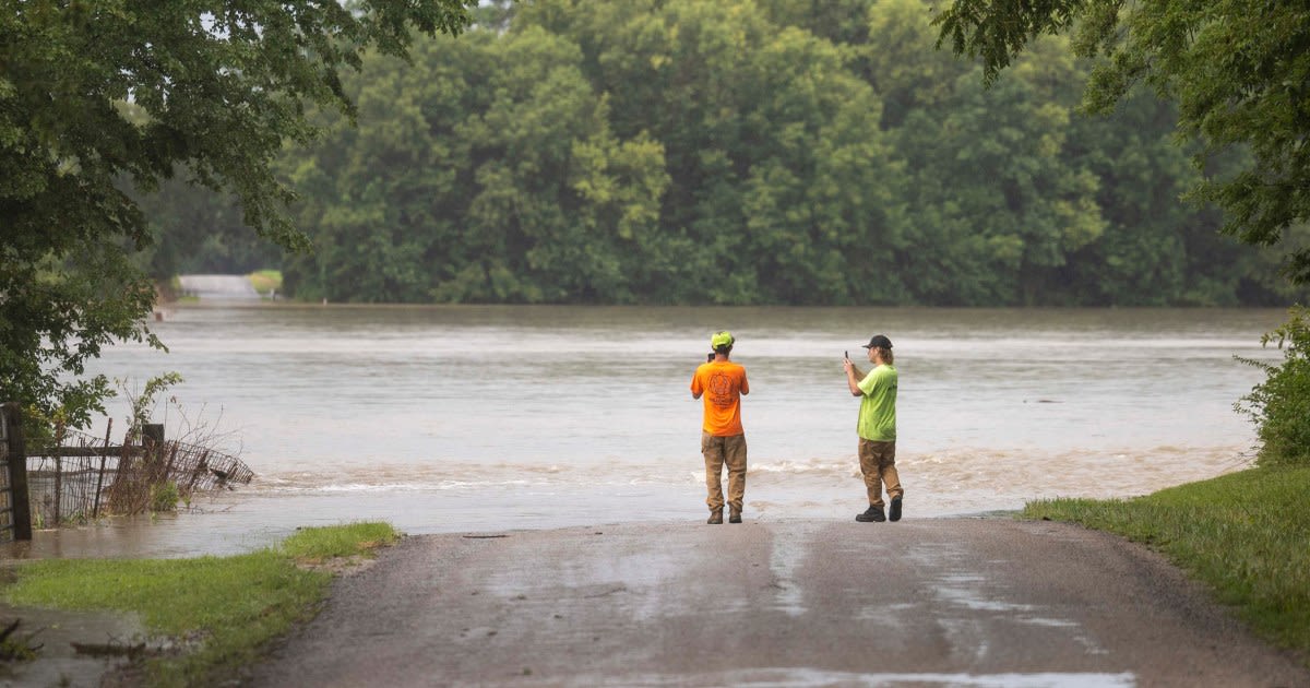 A dam fails after rain, wind and tornadoes pound the Midwest