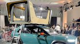 Rivian's new 'treehouse' rooftop tent comes with a movie projector