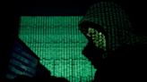 Britain sanctions seven Russians over cyber crime