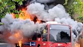 Passengers flee London bus moments before it bursts into flames on busy Twickenham road