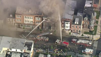 Crews battle multi-family house fire in Allentown amid intense heat