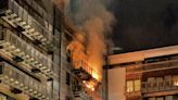 Two firefighters injured in flats blaze as around 100 people evacuated