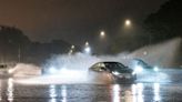 Dam fails in Illinois as US states hit by heavy rain and tornadoes
