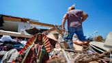 In a north Texas county, dazed residents sift through homes mangled by a tornado