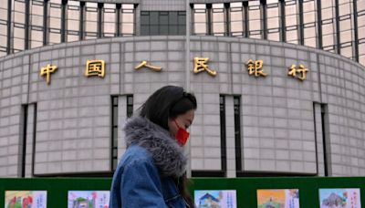 China's central bank cuts interest rates, moving to put more pep into the economy