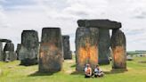 Climate protesters arrested after defacing beloved Stonehenge monument with orange paint