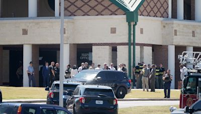 Georgia high school student, 14, kills 4 and wounds 9 in campus shooting