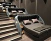 a movie theater with double beds for lying down and watching your ...