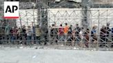 Desperate Palestinians line up for bread in Gaza City amid famine warning