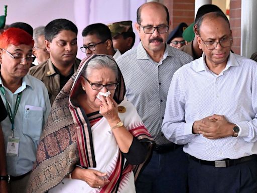 Bangladesh PM accused of ‘crocodile tears’ over damaged train station after 150 killed in violence