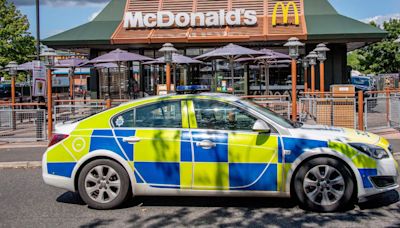 Motorist drives at McDonald's diner in car park road rage