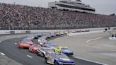 Christopher Bell takes the checkered flag on rain tires in the NASCAR Cup race at New Hampshire