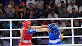 Algerian boxer Imane Khelif, under scrutiny over her gender, wins first Olympic match in 46 seconds