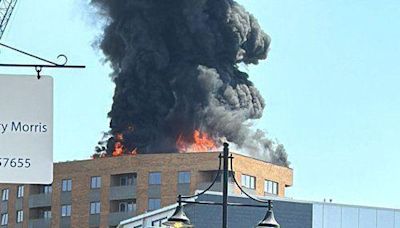 Huge plume of smoke as fire engulfs tower block