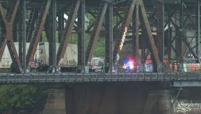 Crews clearing tracks after Steel Bridge train derailment