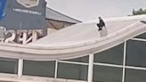 Kids use roof of Tesco Extra in Batley as giant 'water slide'