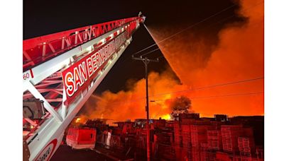 Crews fighting massive pallet yard fire in Fontana