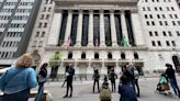 Stock market today: Wall Street points toward losses as markets digest earnings, dealmaking