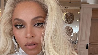 Beyoncé is a vision in white tux as she make surprise visit to Hamptons record store